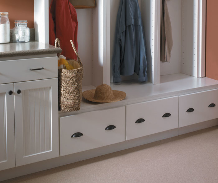 Inspiration for a mid-sized transitional mudroom in Other with orange walls and beige floor.