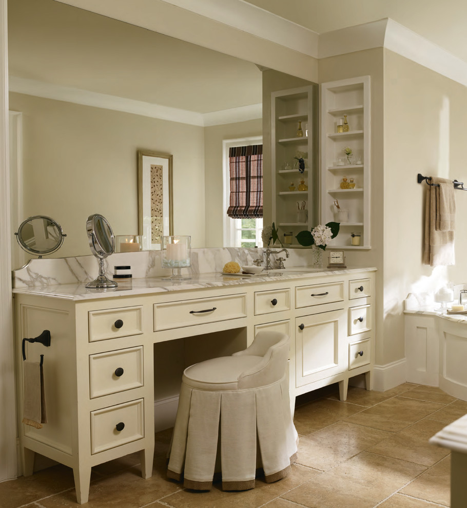 Photo of a large traditional master bathroom in Baltimore with flat-panel cabinets, white cabinets, a corner tub, beige tile, porcelain tile, beige walls, ceramic floors and marble benchtops.