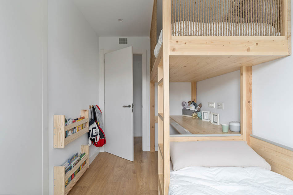 Mid-sized mediterranean gender-neutral kids' room in Barcelona with white walls, laminate floors and brown floor.