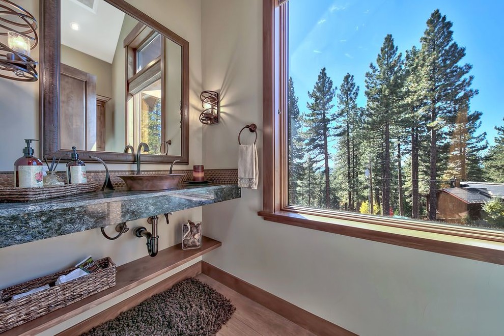 Mid-sized transitional master gray tile bathroom photo with open cabinets, medium tone wood cabinets, a one-piece toilet, gray walls, a vessel sink, granite countertops and gray countertops