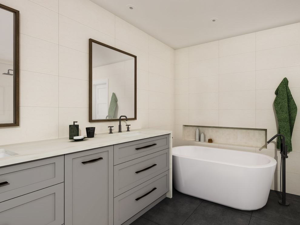 Inspiration for a mid-sized modern master bathroom with shaker cabinets, grey cabinets, a freestanding tub, an alcove shower, a one-piece toilet, beige tile, beige walls, an undermount sink, engineered quartz benchtops, grey floor, a hinged shower door, white benchtops, porcelain tile and slate floors.