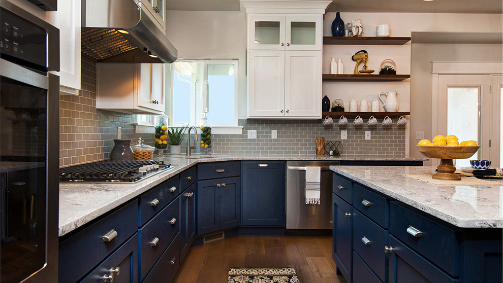 Eat-in kitchen - transitional dark wood floor eat-in kitchen idea in Salt Lake City with a drop-in sink, flat-panel cabinets, blue cabinets, quartz countertops, stainless steel appliances, an island, gray backsplash and subway tile backsplash
