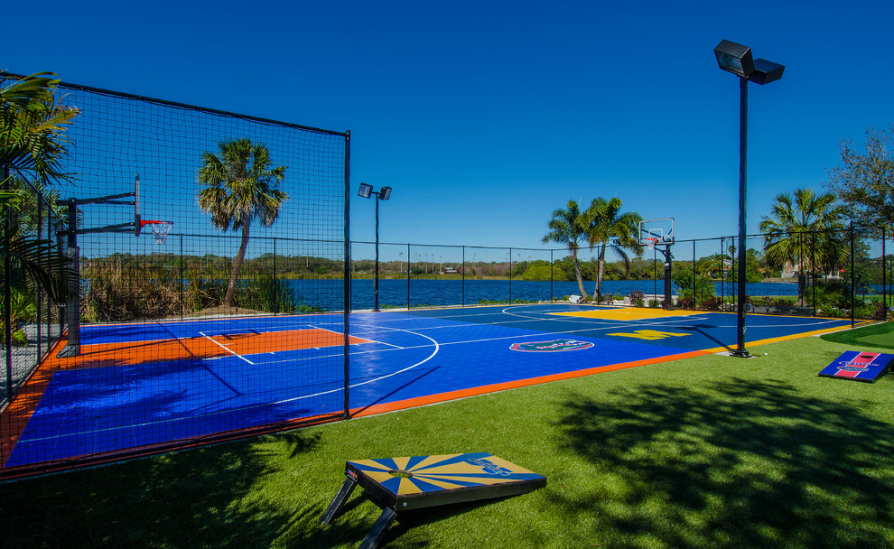 Photo of an expansive contemporary backyard full sun outdoor sport court in Tampa.