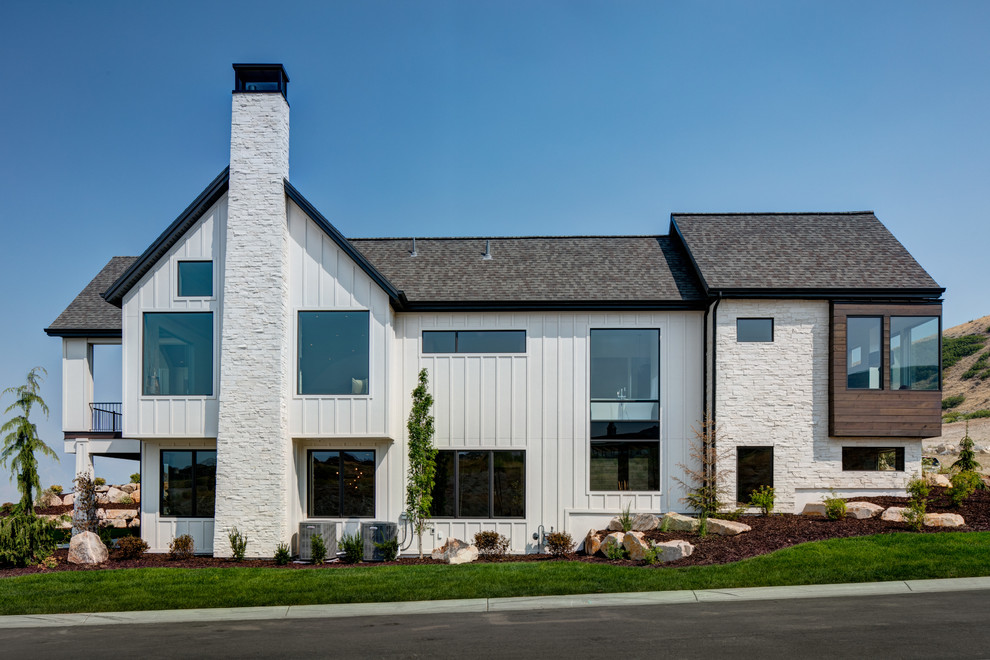 Communities - Herriman, UT (37) - Mid-sized farmhouse white two-story mixed siding gable roof idea in Salt Lake City with a shingle roof