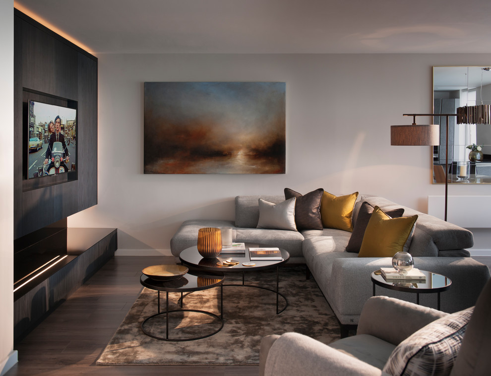 Photo of a medium sized contemporary enclosed living room in Hertfordshire with grey walls, dark hardwood flooring, a wall mounted tv and brown floors.
