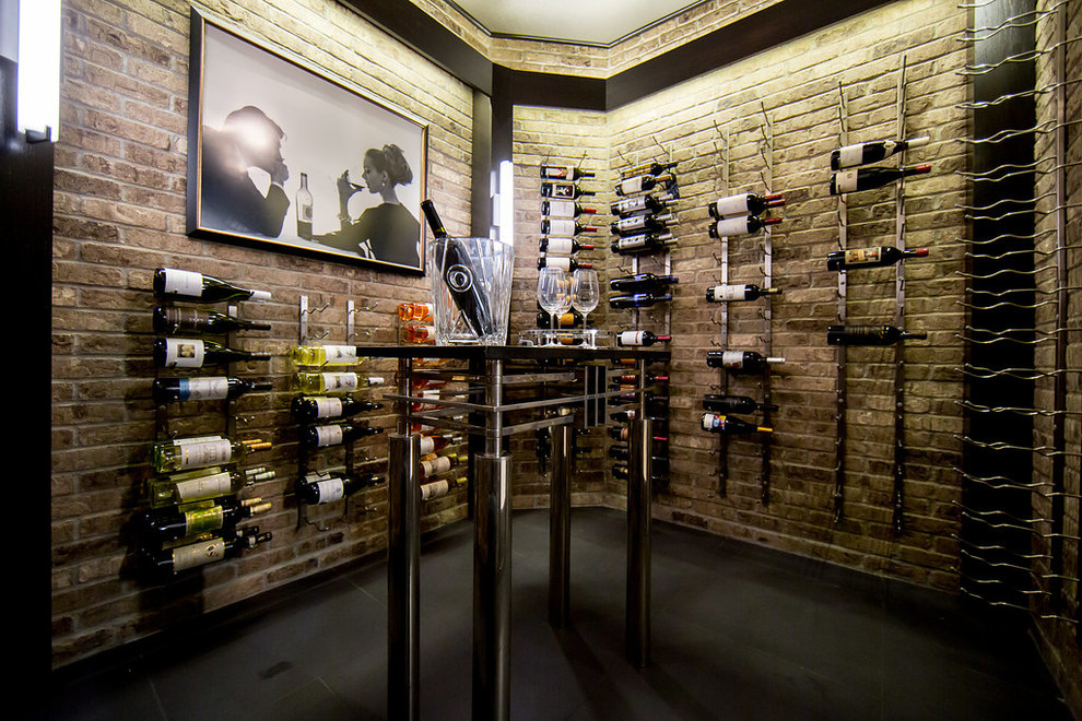 Large industrial wine cellar in Chicago with concrete floors and display racks.