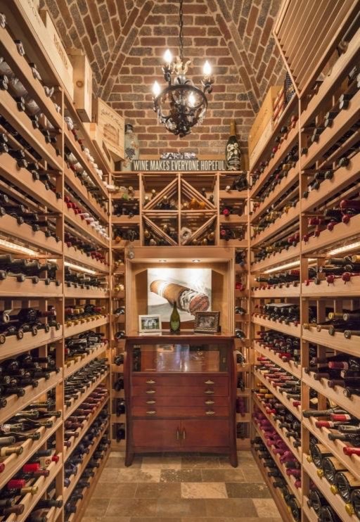 Inspiration for a large mediterranean wine cellar in Phoenix with ceramic floors.