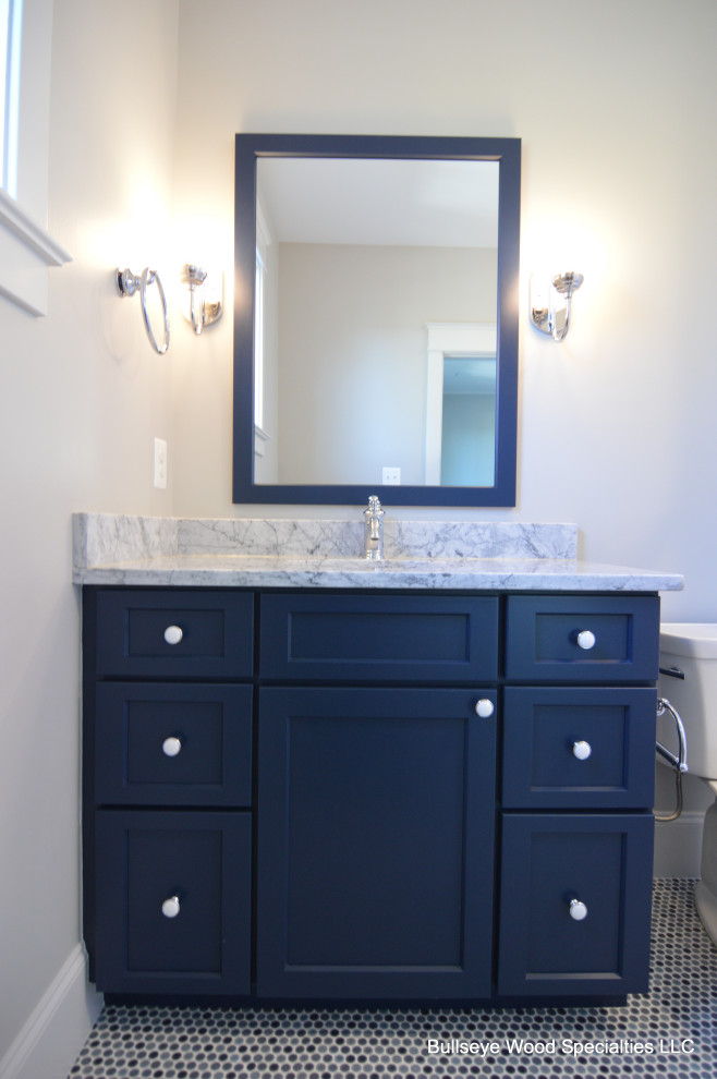 This is an example of a mid-sized arts and crafts kids bathroom in DC Metro with shaker cabinets, blue cabinets, an undermount sink, granite benchtops and grey benchtops.