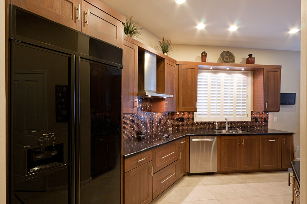 Inspiration for a large transitional ceramic tile eat-in kitchen remodel in Phoenix with an undermount sink, flat-panel cabinets, dark wood cabinets, quartz countertops, multicolored backsplash, mosaic tile backsplash, black appliances and no island