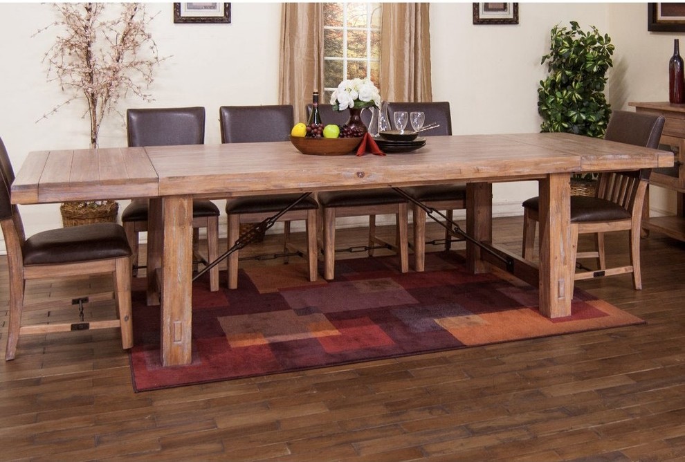 Large mountain style medium tone wood floor dining room photo in New York with white walls