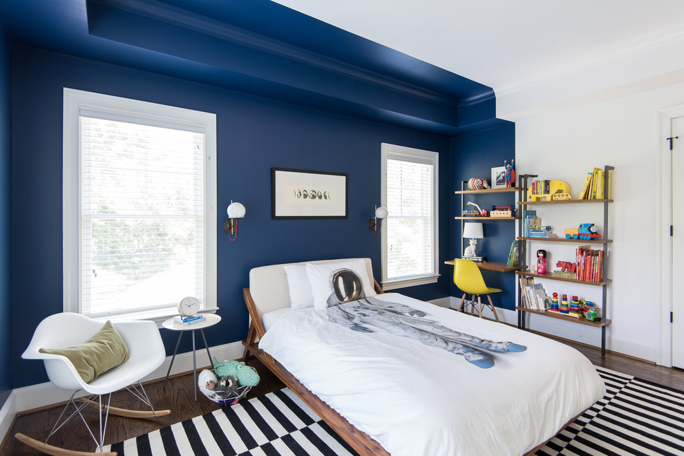 This is an example of a transitional kids' bedroom for boys in DC Metro with dark hardwood floors and multi-coloured walls.