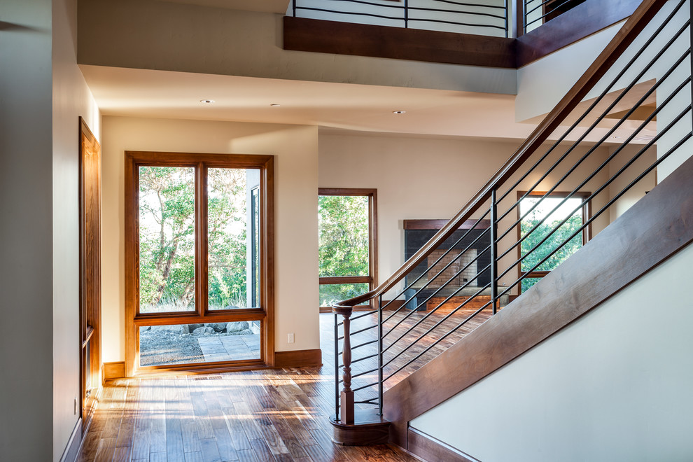 Design ideas for a large contemporary wood curved staircase in Portland.