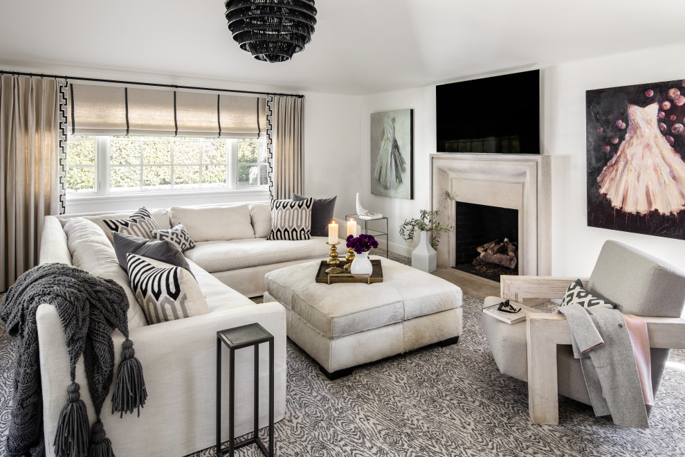 Design ideas for a transitional living room in San Francisco with white walls, carpet, a standard fireplace, a wall-mounted tv and grey floor.