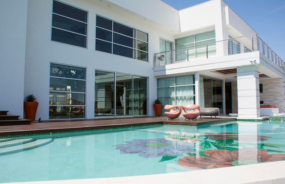 Inspiration for a large modern backyard concrete and custom-shaped natural hot tub remodel in Other