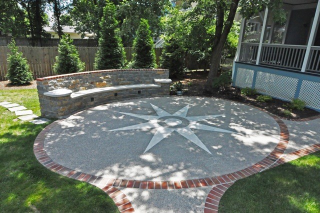 Design ideas for a mid-sized traditional backyard patio in Cincinnati with concrete slab and no cover.