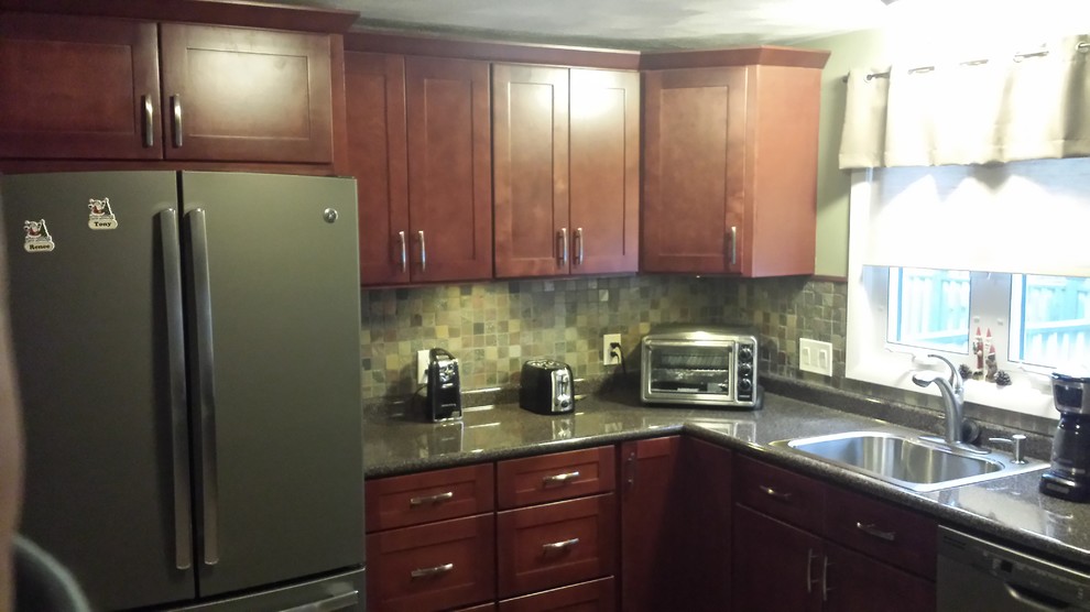 Example of a mid-sized transitional l-shaped eat-in kitchen design in Miami with a drop-in sink, recessed-panel cabinets, medium tone wood cabinets, granite countertops, beige backsplash, subway tile backsplash, stainless steel appliances and no island