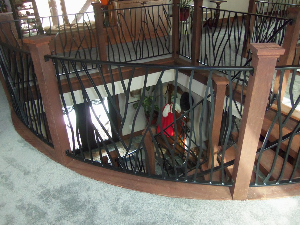 Inspiration for a mid-sized rustic wooden curved staircase remodel with wooden risers