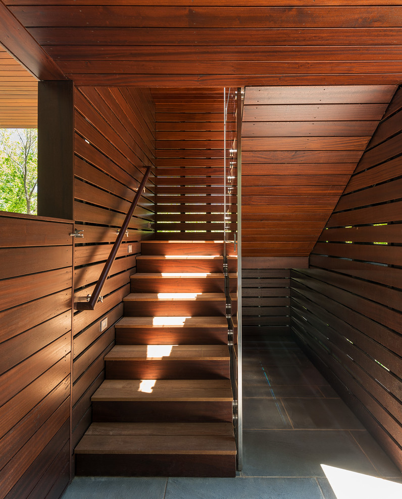 Inspiration for a mid-sized contemporary wood u-shaped staircase in DC Metro with wood risers and wood railing.