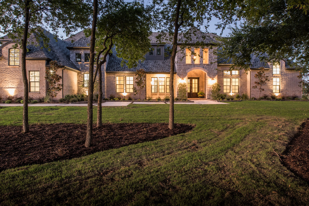 Inspiration for a large transitional medium tone wood floor and brown floor front door remodel in Dallas with white walls and a dark wood front door
