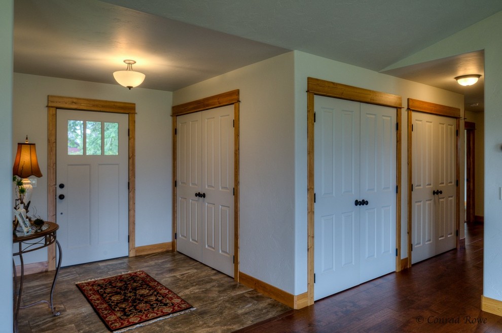 Hallway - mid-sized rustic medium tone wood floor hallway idea with white walls