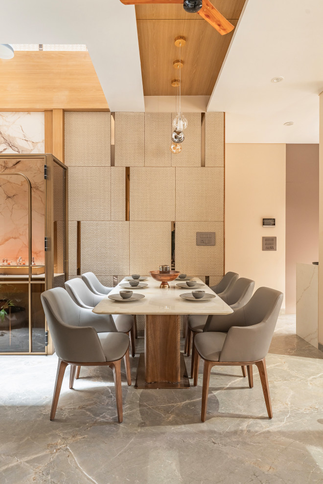 Design ideas for a contemporary dining room in Ahmedabad.