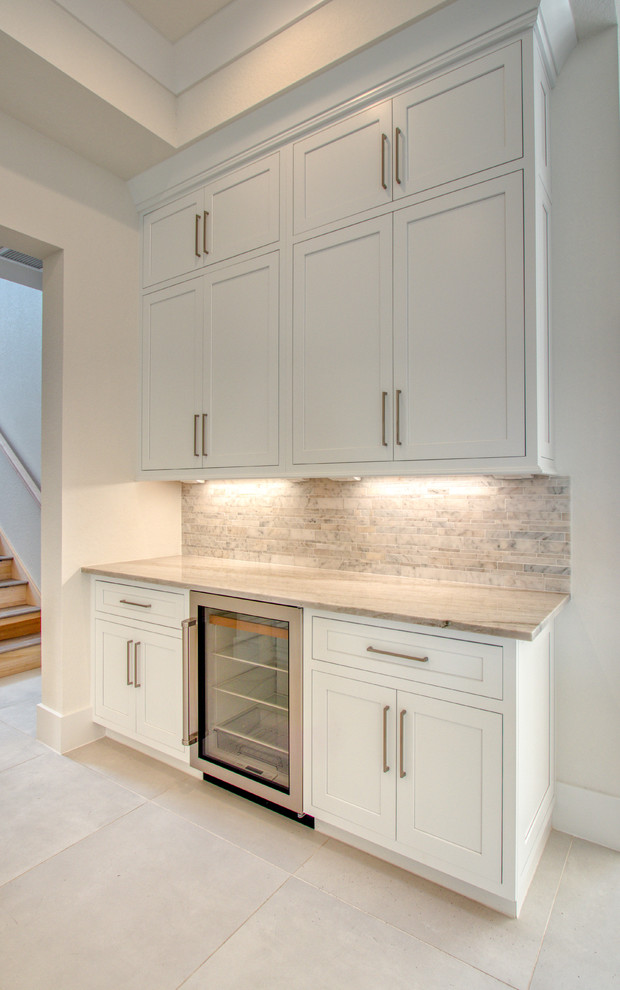 Example of a transitional home design design in Miami