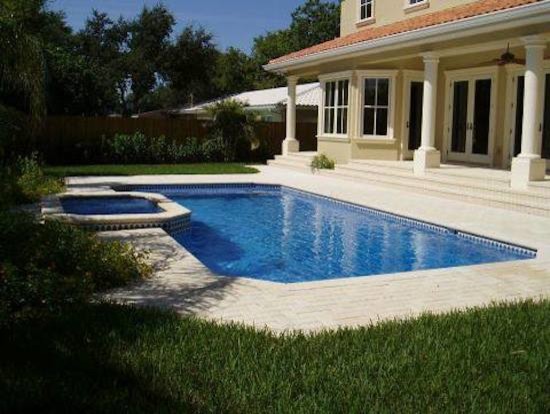Inspiration for a small transitional backyard concrete paver and rectangular hot tub remodel in Tampa