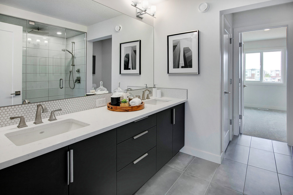 Large contemporary master bathroom in Calgary with flat-panel cabinets, grey cabinets, a double shower, a two-piece toilet, white tile, ceramic tile, white walls, ceramic floors, an undermount sink, engineered quartz benchtops, grey floor, a hinged shower door, white benchtops, a shower seat, a double vanity and a built-in vanity.