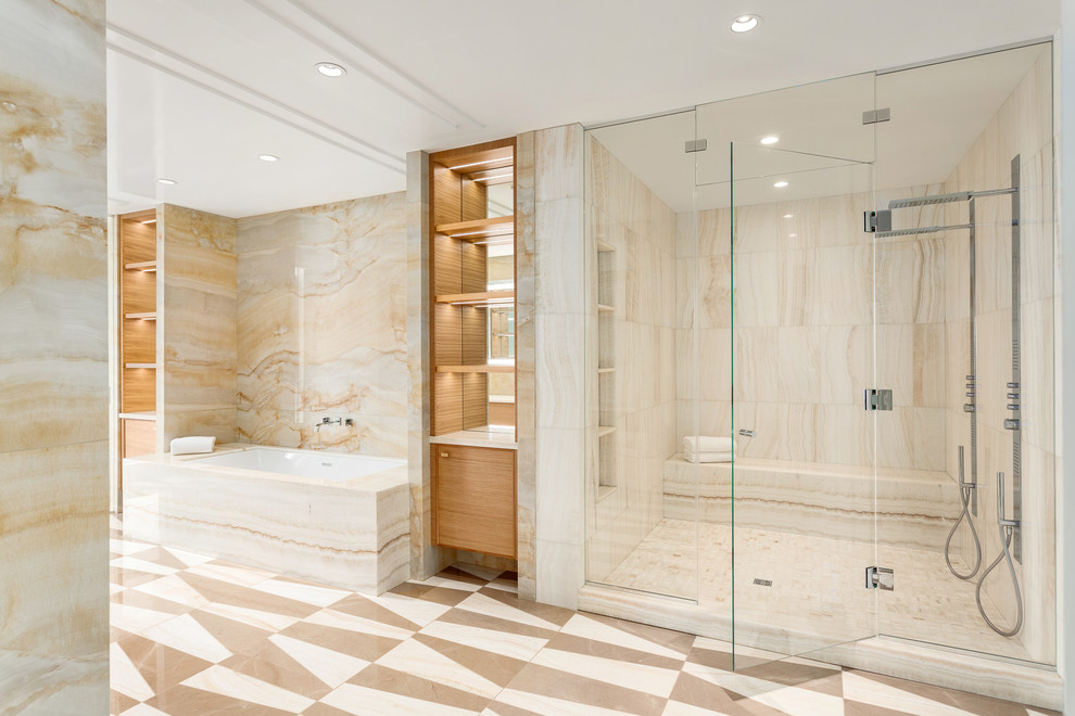 This is an example of an expansive contemporary master bathroom in Vancouver with beaded inset cabinets, a drop-in tub, a corner shower, a one-piece toilet, multi-coloured tile, mosaic tile, multi-coloured walls, marble floors, a drop-in sink, onyx benchtops and medium wood cabinets.