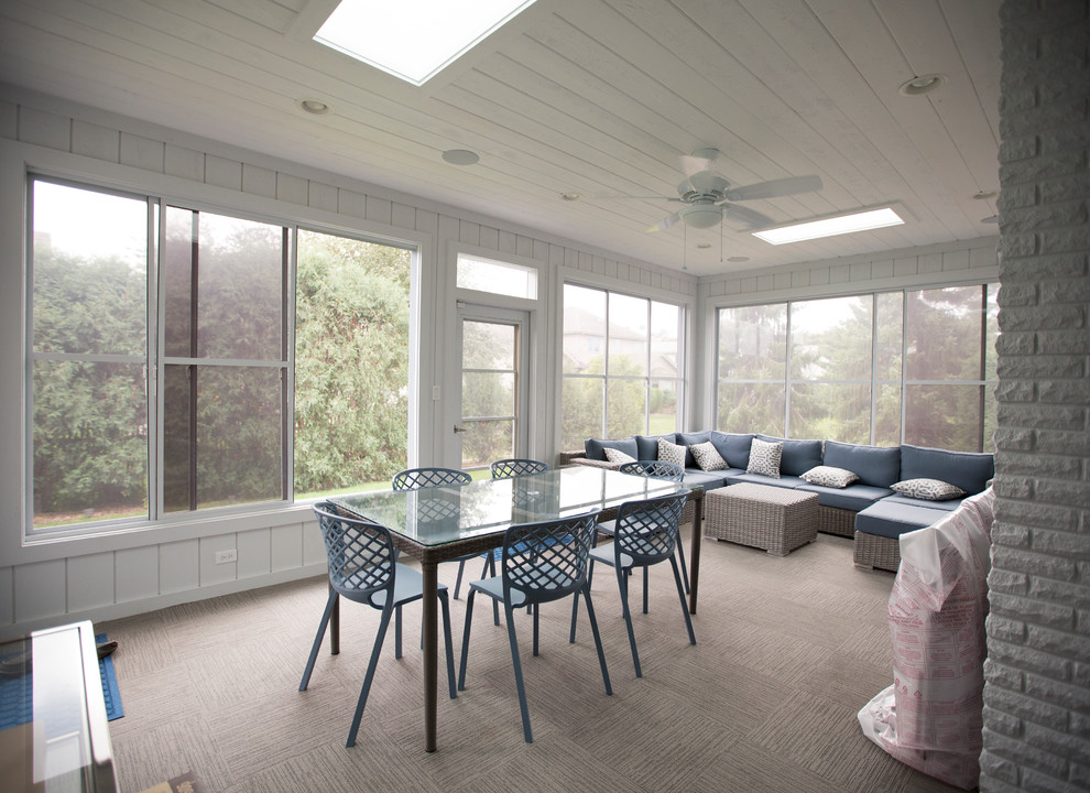This is an example of a beach style sunroom in Chicago.