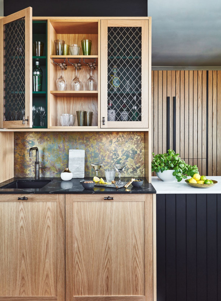 Inspiration for a contemporary u-shaped utility room in Other with a drop-in sink, shaker cabinets, black cabinets, quartzite benchtops, metallic splashback, a concealed washer and dryer and white benchtop.