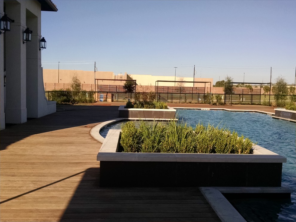 Example of a large beach style backyard deck container garden design in Houston