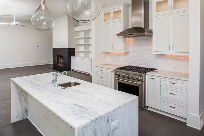 Design ideas for a mid-sized beach style kitchen in Charleston with medium hardwood floors.