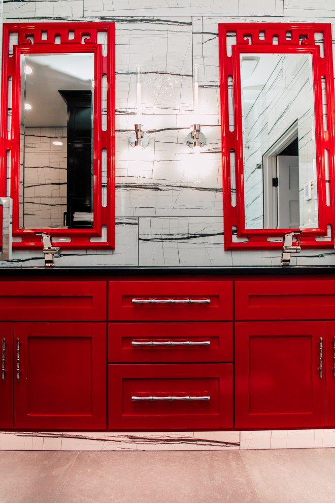 This is an example of a mid-sized asian master bathroom in Seattle with shaker cabinets, red cabinets, a curbless shower, a wall-mount toilet, black and white tile, porcelain tile, white walls, porcelain floors, an undermount sink, engineered quartz benchtops, grey floor, a hinged shower door, black benchtops, a niche, a double vanity and a floating vanity.