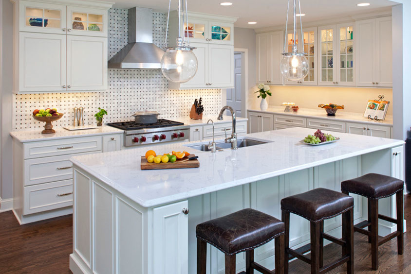 Example of a large transitional l-shaped dark wood floor and brown floor open concept kitchen design in Orange County with recessed-panel cabinets, stainless steel appliances, an island, an undermount sink, white cabinets, marble countertops, white backsplash and mosaic tile backsplash