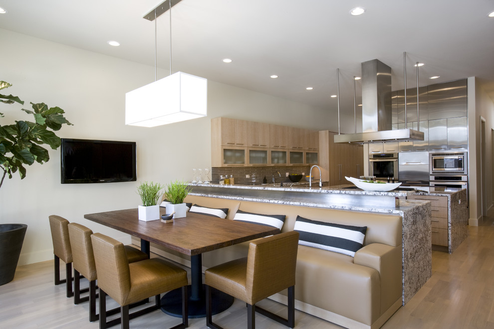 Contemporary kitchen in Chicago with granite benchtops and stainless steel appliances.