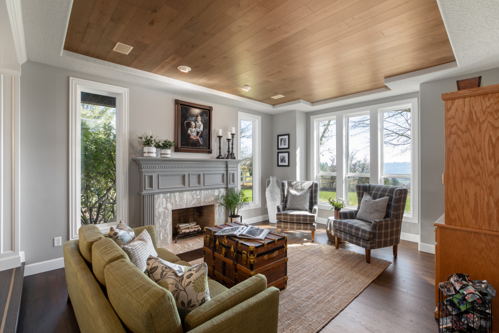 This is an example of a mid-sized transitional formal open concept living room in Portland with grey walls, dark hardwood floors, a standard fireplace, a tile fireplace surround, no tv, brown floor and wood.