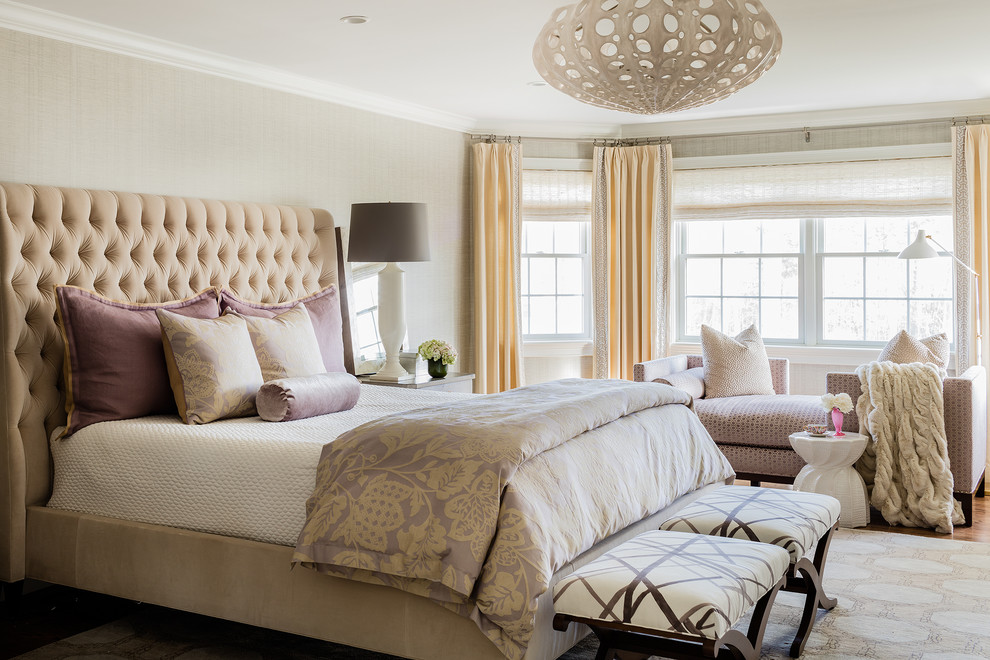 Design ideas for a large transitional master bedroom in Boston with beige walls and light hardwood floors.