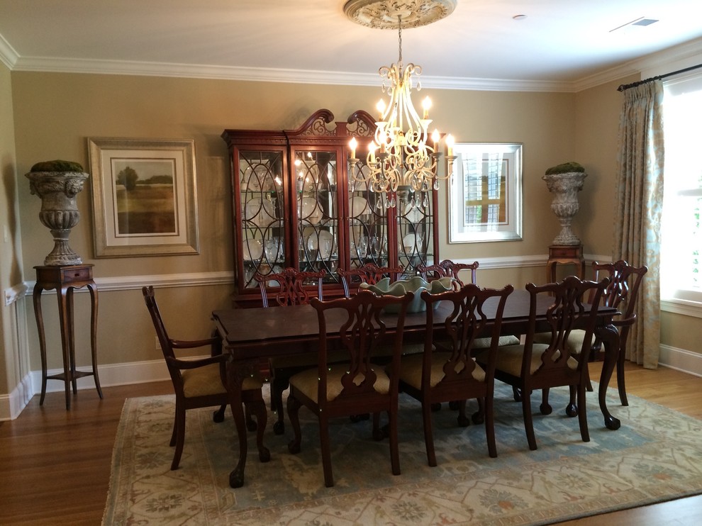 Dining room - mid-sized transitional medium tone wood floor dining room idea with beige walls