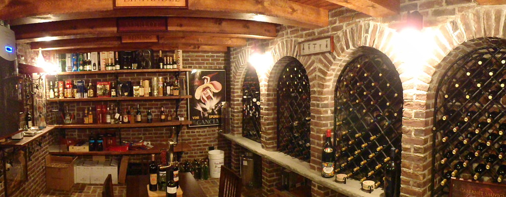 This is an example of a mid-sized country wine cellar in New York.