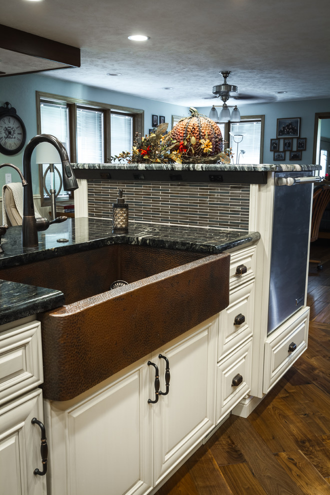 Large transitional l-shaped eat-in kitchen photo with a farmhouse sink and two islands