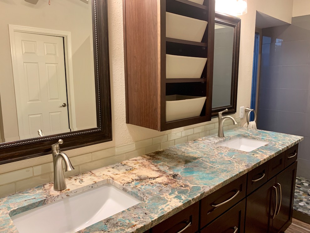 Inspiration for a mid-sized transitional master bathroom in Phoenix with shaker cabinets, medium wood cabinets, an alcove shower, gray tile, porcelain tile, beige walls, porcelain floors, a drop-in sink, granite benchtops, multi-coloured floor, an open shower and turquoise benchtops.