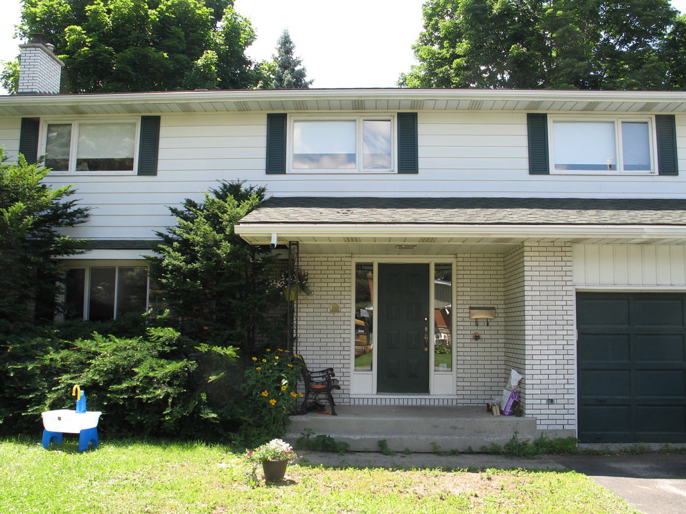 White house with green roof green shutters and red front door?