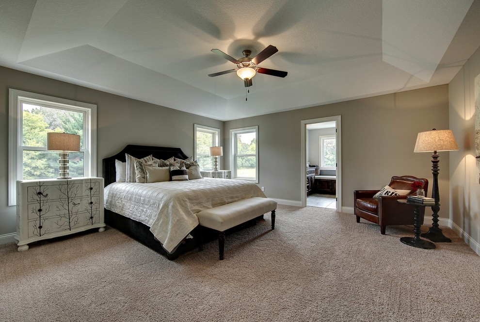 Inspiration for a large traditional master bedroom in Minneapolis with beige walls, carpet and no fireplace.