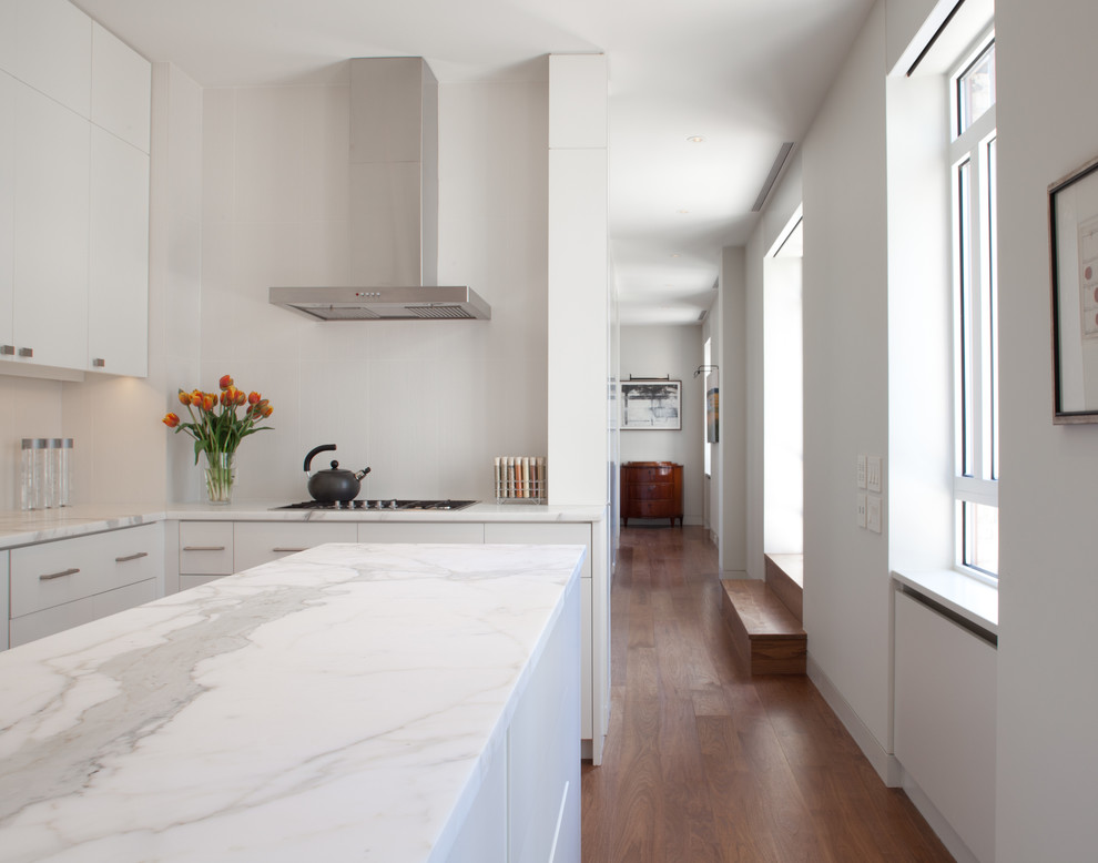 Photo of a contemporary kitchen in New York with marble benchtops.