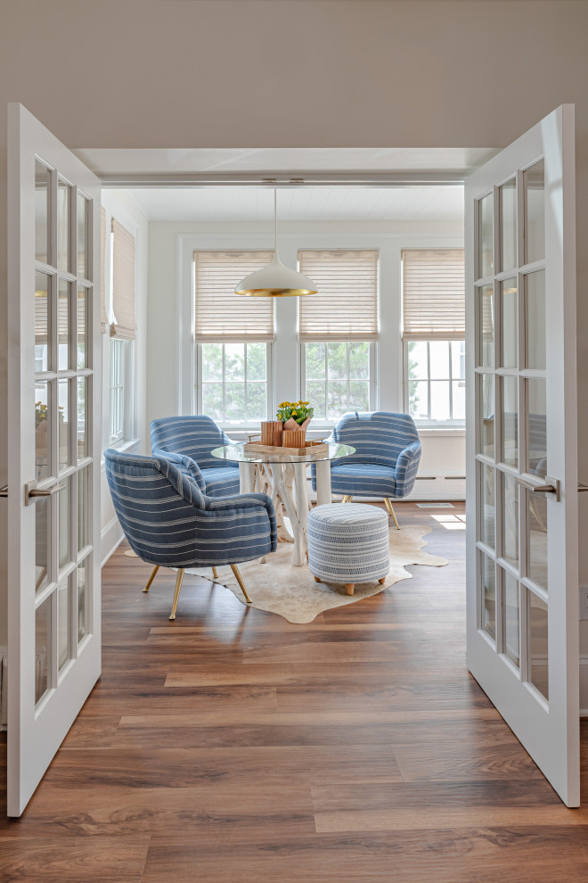 Inspiration for a large beach style sunroom in Philadelphia with vinyl floors, a standard ceiling and brown floor.