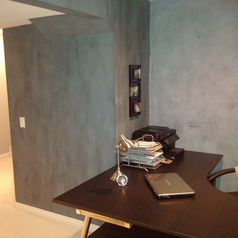 Photo of a mid-sized scandinavian home office in Calgary with blue walls.