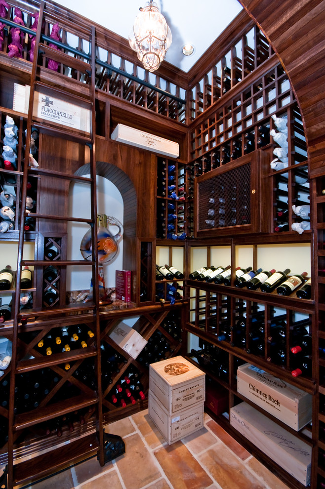 Inspiration for a large traditional wine cellar in Miami with display racks and ceramic floors.