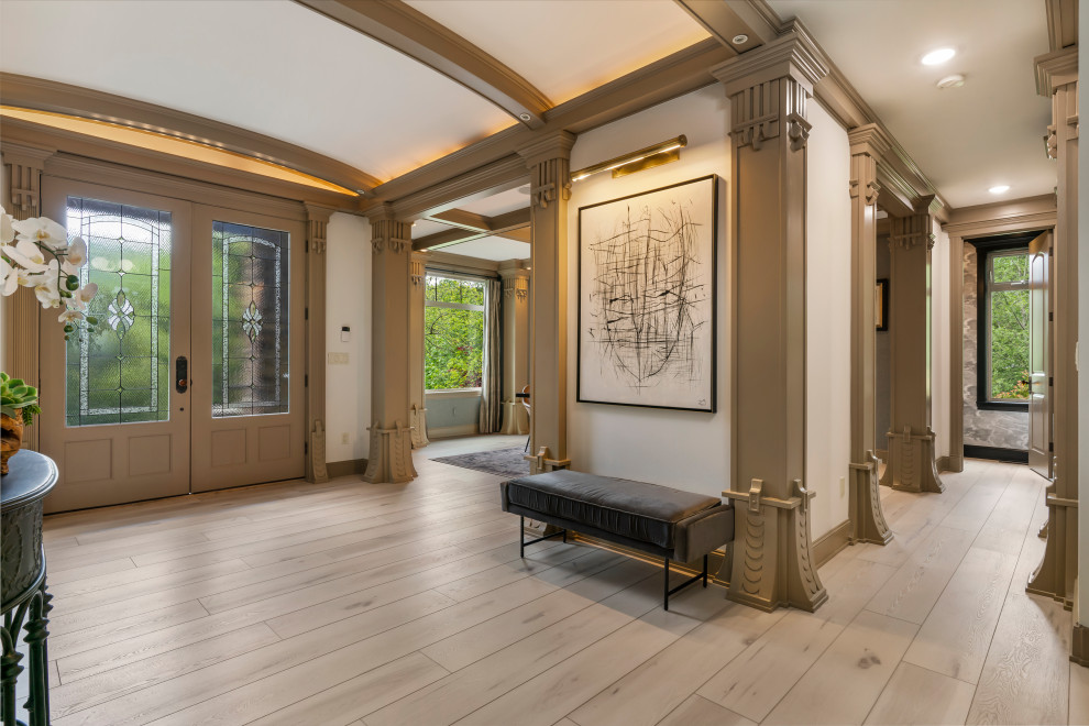 Photo of a large traditional front door in Seattle with white walls, vinyl flooring, a double front door, a brown front door, beige floors and a coffered ceiling.
