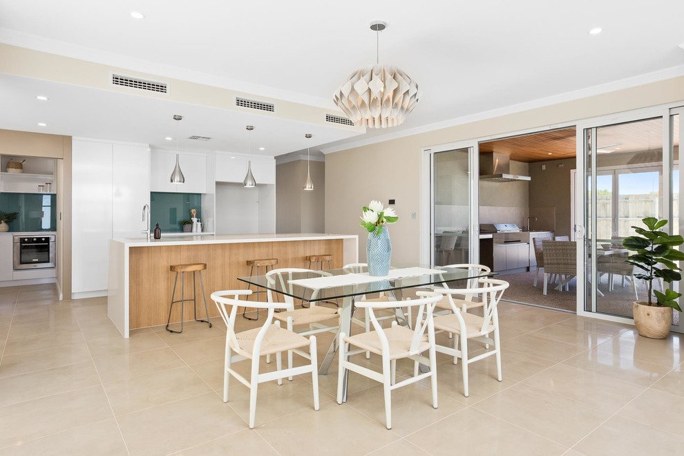 Mid-sized beach style kitchen/dining combo in Perth with beige walls, ceramic floors and beige floor.